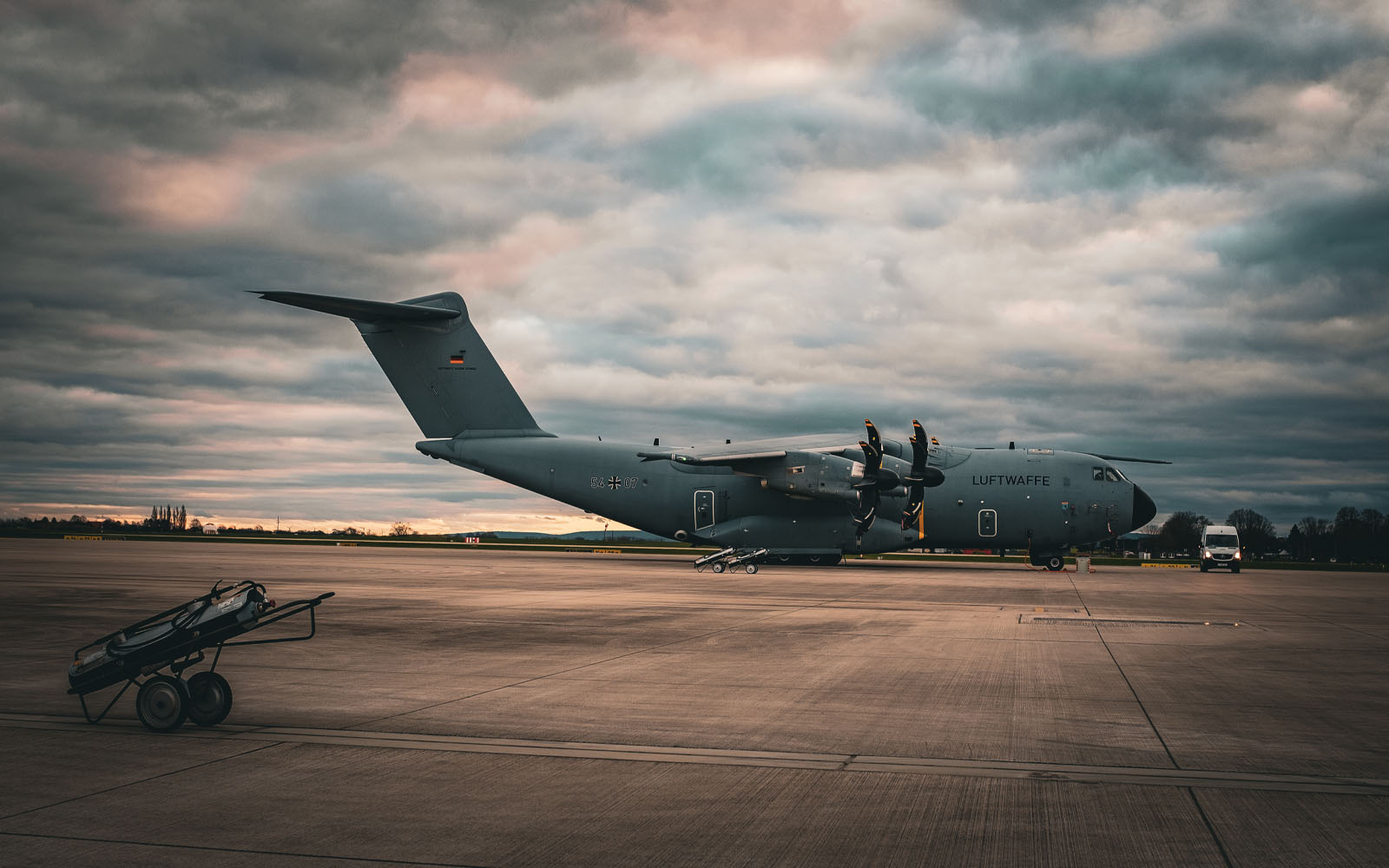Wide shot of an RAF plane on a runway.