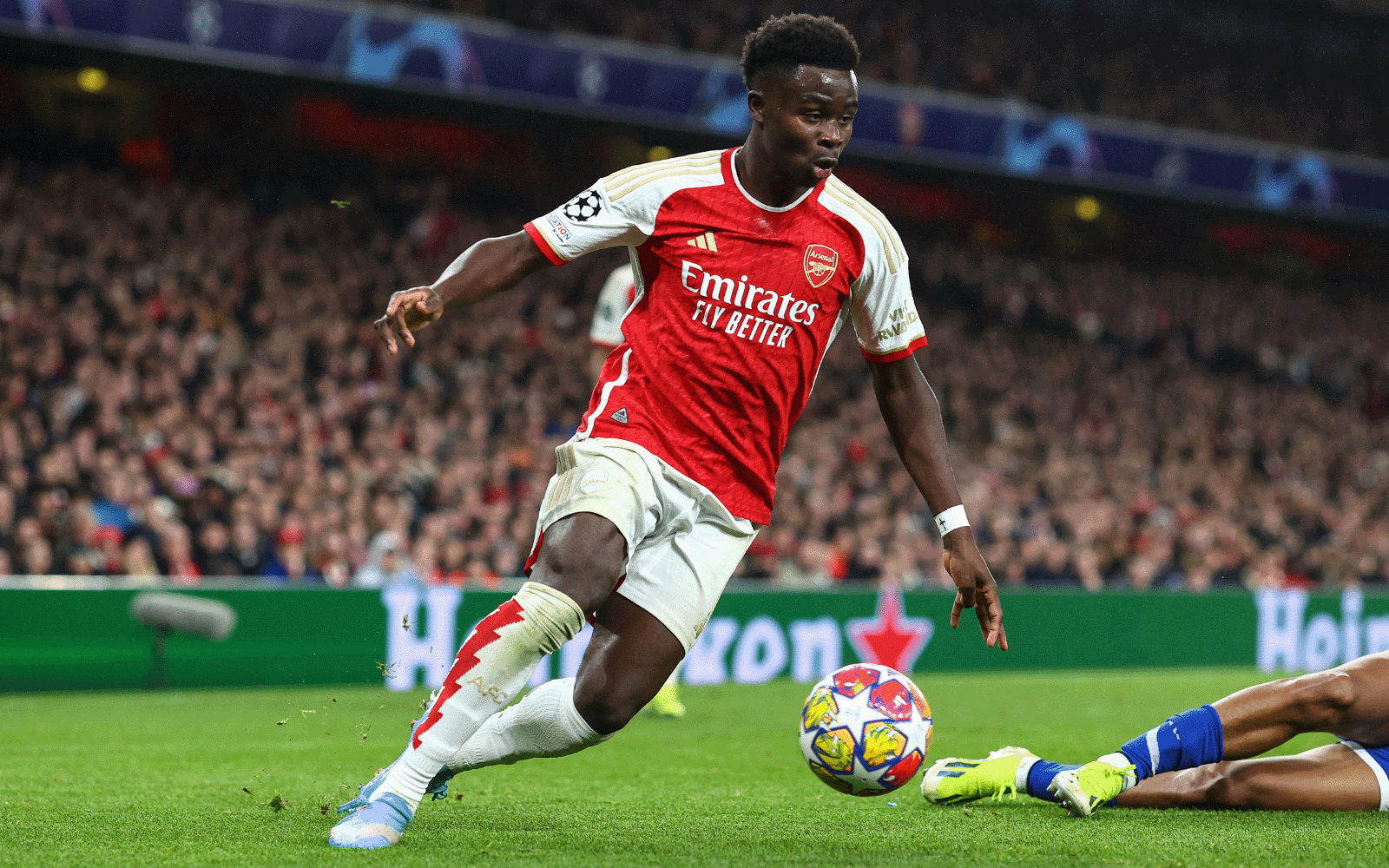Action shot of an Arsenal football, dribbling with a football.