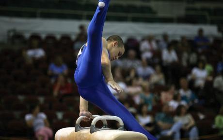Gymnast balancing using just his hands.