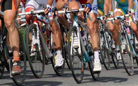 Close up of a group of cyclists mid-race.