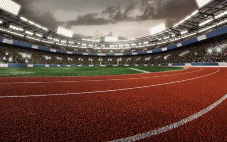 Close up of a race track inside a stadium.