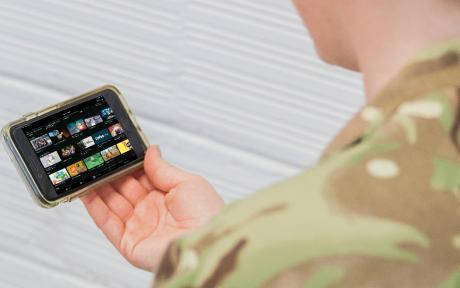 Person using the BFBS TV Player app on mobile device.