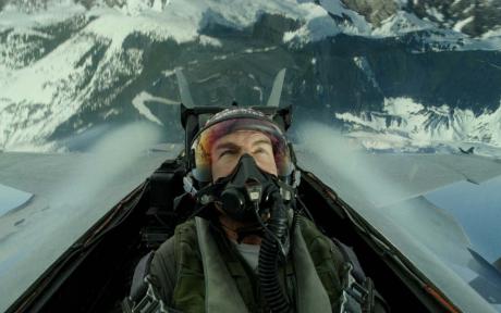 Movie still from the film Top Gun: Maverick. Close up of Tom Cruise's character in a plane cockpit.