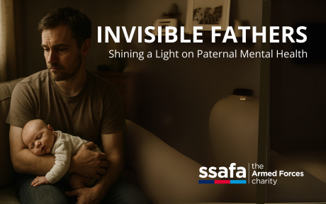 Father holding a child. Text 'Invisible Fathers'.