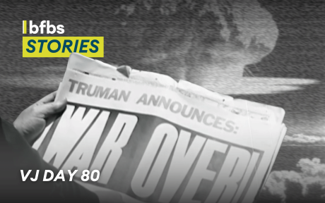 Close up of person holding newspaper from 1945. Paper headline says 'Truman announces war over'. Text 'BFBS Stories, VJ Day 80'.