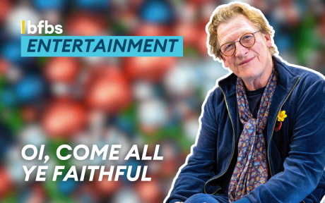 Cut out of Geoff Bell, blurred background of Christmas baubles, text 'Oi, Come All Ye Faithful'.