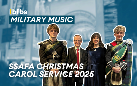 Cut out of BFBS team with serving personnel at the SSAFA Christmas Carol Concert 2025.