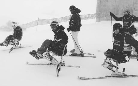 Group of veterans on a ski-slope.
