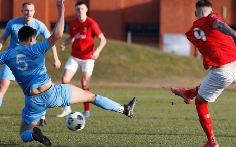 Action shot from a military football match.
