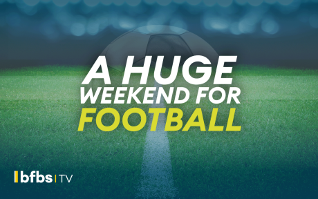 Close up of a football pitch, text 'a huge weekend for football'.