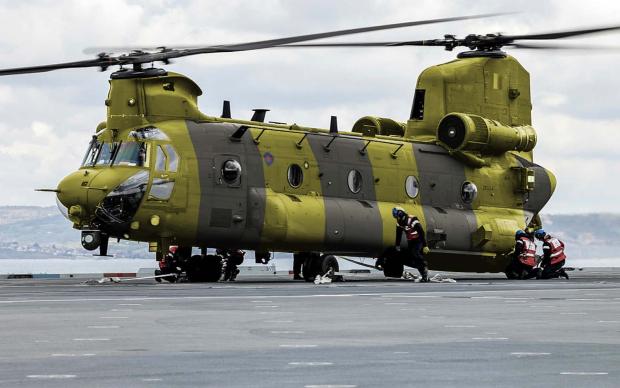 Close up of an RAF helicopter, black and yellow colours.