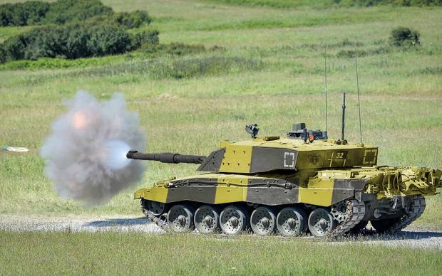 Close up of an Army tank, black and yellow colours.